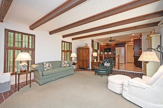 667 N Meadowcrest Cir, Springfield Twp, OH 45231 - living area featuring beamed ceiling, ceiling fan, and baseboards