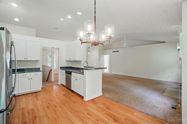 7785 Dew Drop Cir, Hamilton Twp, OH 45039 - kitchen with appliances with stainless steel finishes, a peninsula, white cabinets, ceiling fan, and open floor plan