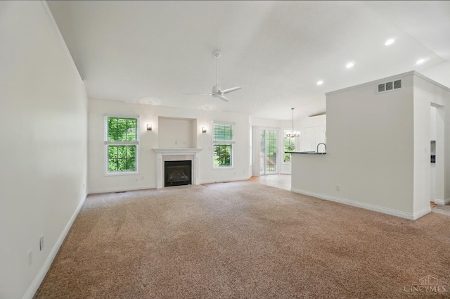 7785 Dew Drop Cir, Hamilton Twp, OH 45039 - unfurnished living room with a ceiling fan, a fireplace with flush hearth, light colored carpet, baseboards, and recessed lighting