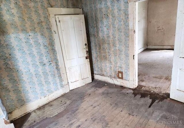 338 S Walnut St, Wilmington, OH 45177 - foyer entrance featuring wood-type flooring and wallpapered walls