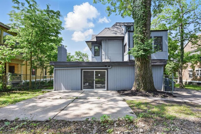 752 S Fred Shuttlesworth Cir, Cincinnati, OH 45229 - rear view of house with a chimney