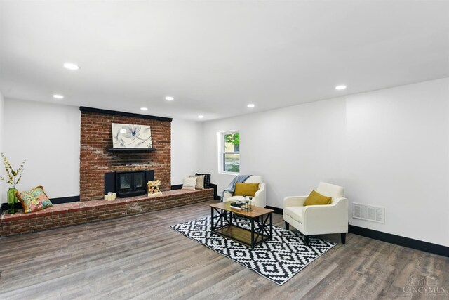752 S Fred Shuttlesworth Cir, Cincinnati, OH 45229 - living area with wood finished floors, recessed lighting, a fireplace, and baseboards
