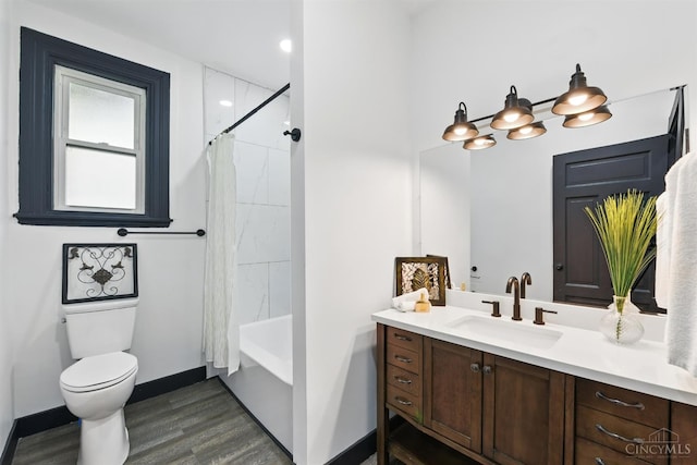 752 S Fred Shuttlesworth Cir, Cincinnati, OH 45229 - full bathroom featuring wood finished floors, vanity, toilet, baseboards, and shower / tub combo