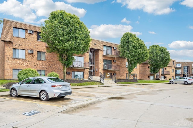 6644 Hearne Rd Unit 202, Green Twp, OH 45248 - view of building exterior featuring uncovered parking