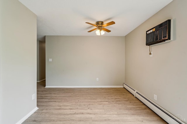 6644 Hearne Rd Unit 202, Green Twp, OH 45248 - unfurnished room featuring a baseboard heating unit, a ceiling fan, a wall mounted AC, light wood-type flooring, and baseboards