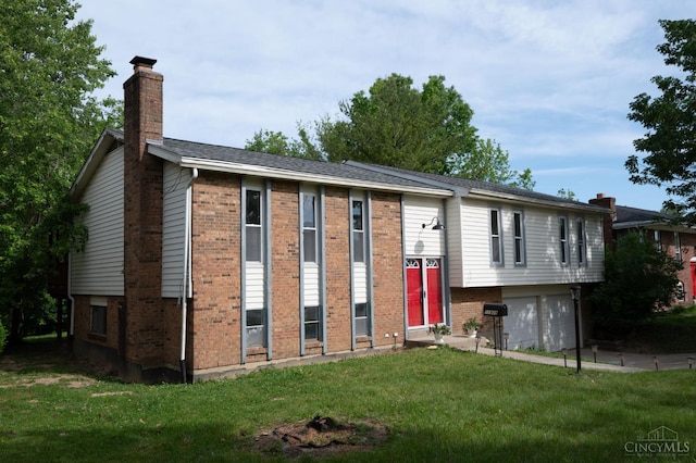 11909 Blackhawk Cir, Springfield Twp, OH 45240 - view of front of house featuring brick siding, a chimney, a garage, and a front lawn