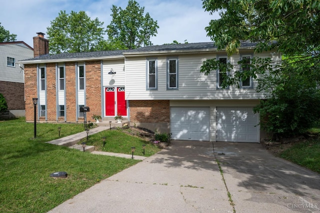 11909 Blackhawk Cir, Springfield Twp, OH 45240 - raised ranch featuring brick siding, a front lawn, a garage, driveway, and a chimney