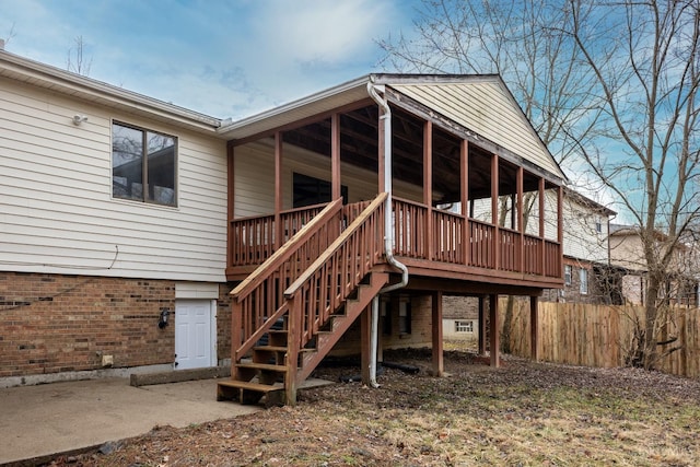 11909 Blackhawk Cir, Springfield Twp, OH 45240 - rear view of property featuring stairway, brick siding, a wooden deck, and crawl space