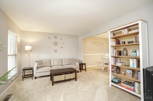 5509 Windmere Dr, Green Twp, OH 45248 - living room featuring light carpet and baseboards
