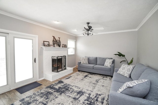 5509 Windmere Dr, Green Twp, OH 45248 - living area with ornamental molding, wood finished floors, a fireplace, baseboards, and a ceiling fan