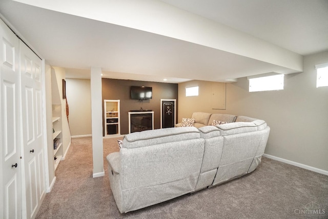 5509 Windmere Dr, Green Twp, OH 45248 - carpeted living room with healthy amount of natural light and baseboards