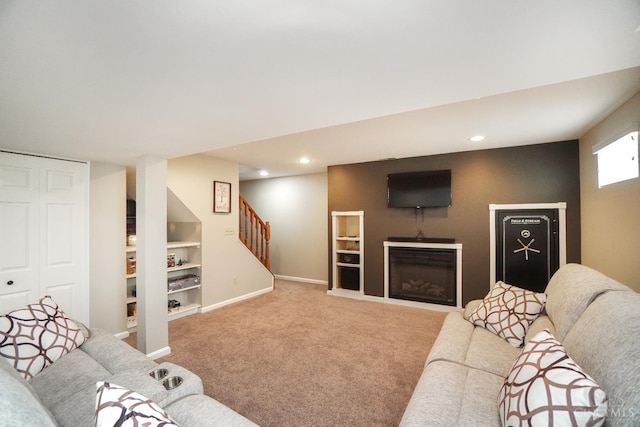 5509 Windmere Dr, Green Twp, OH 45248 - carpeted living area with stairs, baseboards, built in shelves, and recessed lighting
