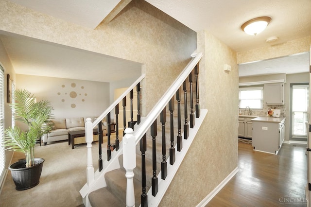 5509 Windmere Dr, Green Twp, OH 45248 - stairs featuring wood finished floors and baseboards