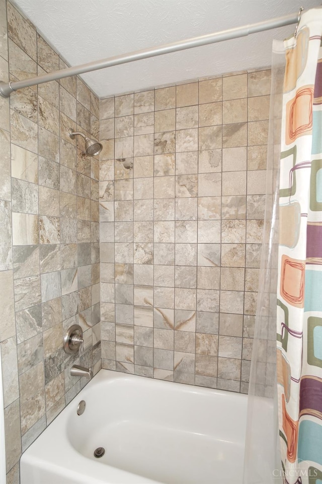 5509 Windmere Dr, Green Twp, OH 45248 - full bath with shower / bath combo with shower curtain and a textured ceiling
