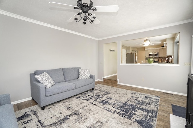 5509 Windmere Dr, Green Twp, OH 45248 - living area featuring a ceiling fan, wood finished floors, ornamental molding, and baseboards