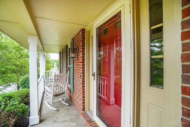 5509 Windmere Dr, Green Twp, OH 45248 - entrance to property with brick siding and covered porch