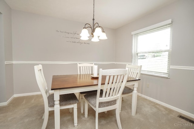 5509 Windmere Dr, Green Twp, OH 45248 - dining space with light colored carpet, a chandelier, and baseboards