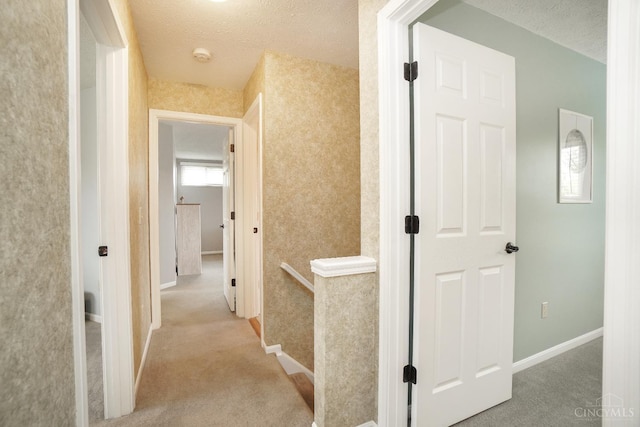 5509 Windmere Dr, Green Twp, OH 45248 - hallway with carpet, a textured ceiling, and baseboards