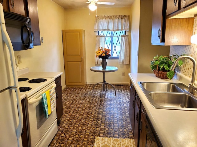 9521 Haddington Ct, Colerain Twp, OH 45251 - kitchen with white appliances, a sink, light countertops, ceiling fan, and baseboards