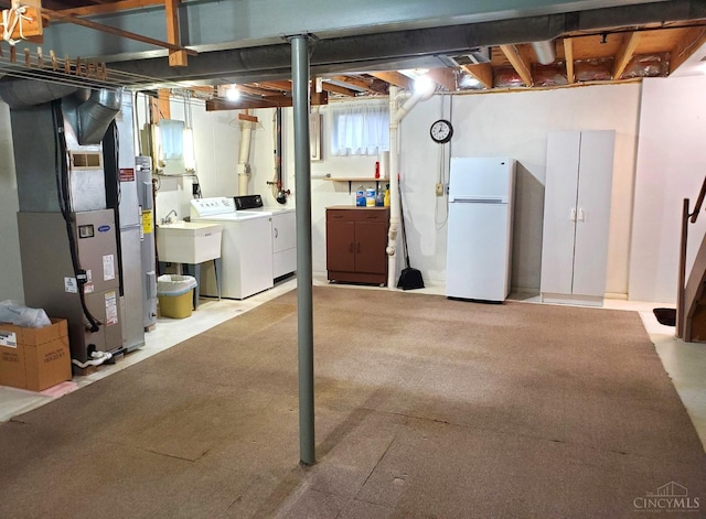 9521 Haddington Ct, Colerain Twp, OH 45251 - unfinished below grade area featuring freestanding refrigerator, washing machine and clothes dryer, and heating unit