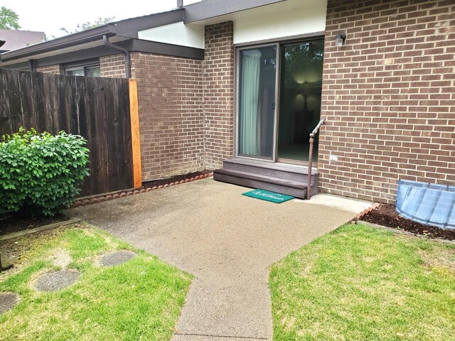 9521 Haddington Ct, Colerain Twp, OH 45251 - entrance to property featuring a patio area and brick siding