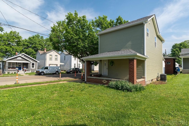 926 Shuler Ave, Hamilton, OH 45011 - view of side of property featuring covered porch, a yard, and central air condition unit