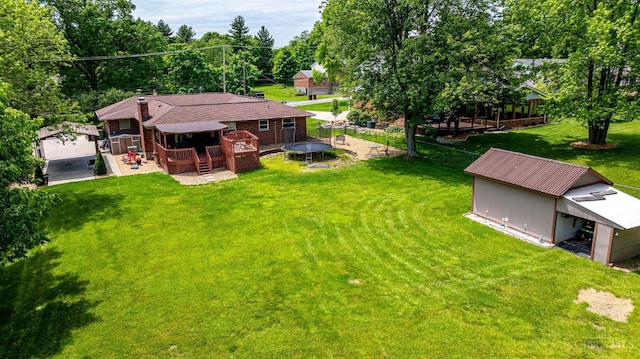 1366 Devils Backbone Rd, Green Twp, OH 45233 - view of grassy yard featuring a deck and an outdoor structure