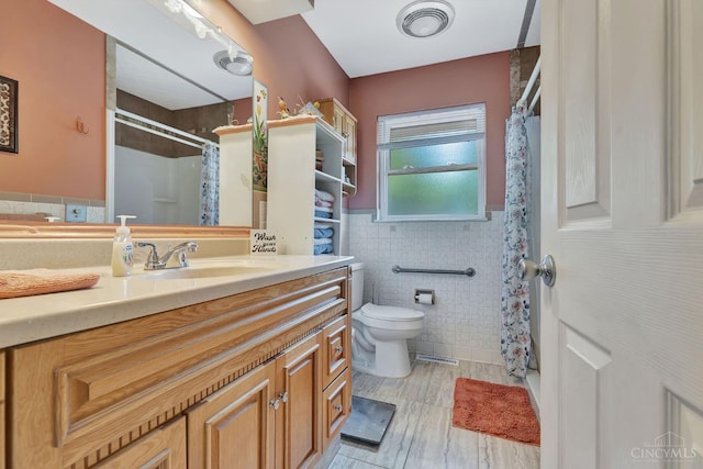 1366 Devils Backbone Rd, Green Twp, OH 45233 - full bath featuring tile walls, toilet, vanity, curtained shower, and a wainscoted wall
