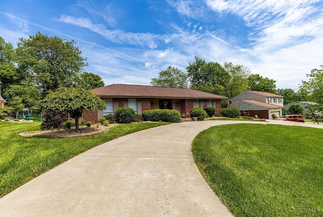 1366 Devils Backbone Rd, Green Twp, OH 45233 - single story home with curved driveway, a front lawn, and brick siding