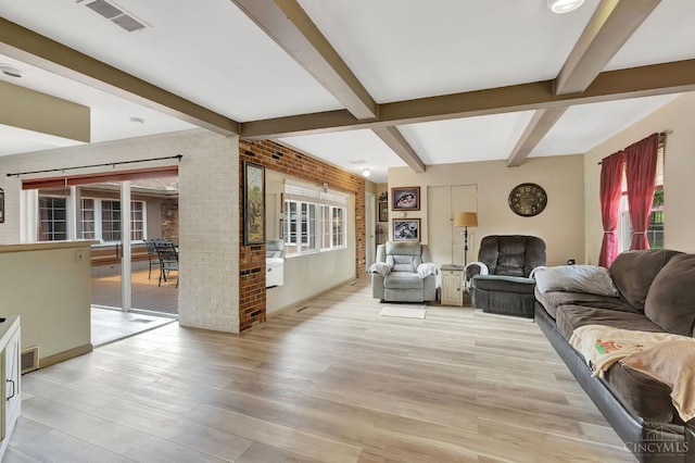 1366 Devils Backbone Rd, Green Twp, OH 45233 - living area featuring beamed ceiling, light wood finished floors, and brick wall
