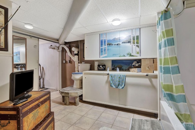 1366 Devils Backbone Rd, Green Twp, OH 45233 - bathroom with a drop ceiling, tile patterned flooring, toilet, and shower / bath combo