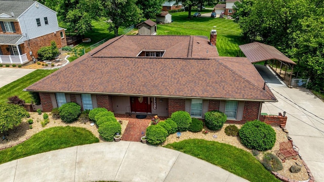 1366 Devils Backbone Rd, Green Twp, OH 45233 - view of front of home featuring brick siding, driveway, a shingled roof, a front lawn, and a carport