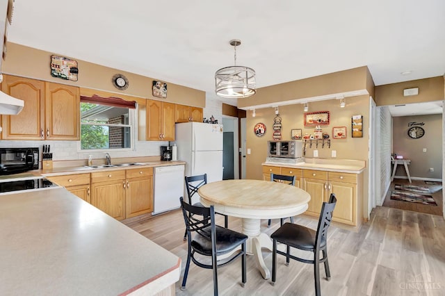 1366 Devils Backbone Rd, Green Twp, OH 45233 - kitchen featuring white appliances, a sink, light wood-type flooring, decorative backsplash, and light countertops