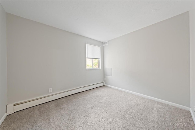 4906 Chalet Dr Unit 7, Saint Bernard, OH 45217 - carpeted spare room featuring a baseboard radiator and baseboards