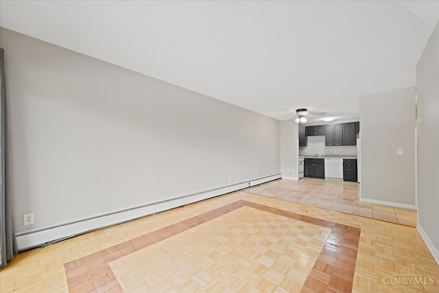 4906 Chalet Dr Unit 7, Saint Bernard, OH 45217 - unfurnished living room featuring a baseboard radiator and a ceiling fan