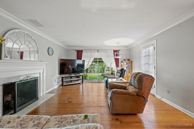 200 Santa Fe Rd, Middletown, OH 45042 - living room featuring a high end fireplace, ornamental molding, and wood finished floors