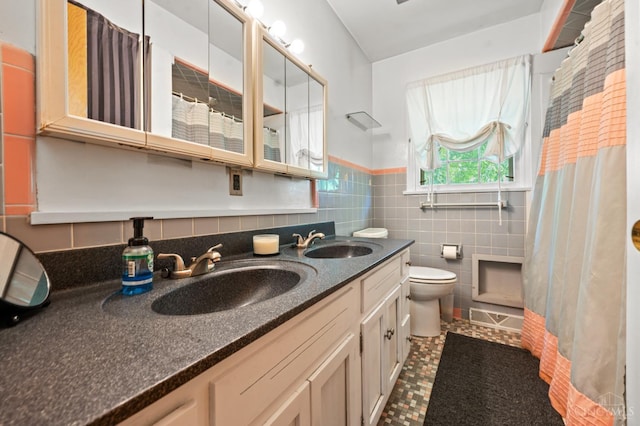 200 Santa Fe Rd, Middletown, OH 45042 - full bath featuring tile walls, double vanity, wainscoting, curtained shower, and tile patterned floors