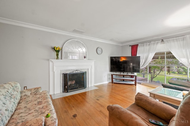 200 Santa Fe Rd, Middletown, OH 45042 - living room with ornamental molding, a fireplace with flush hearth, and wood finished floors