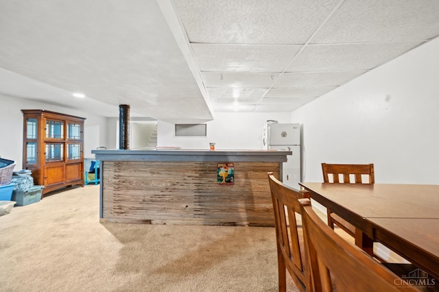 200 Santa Fe Rd, Middletown, OH 45042 - indoor dry bar with freestanding refrigerator and light carpet