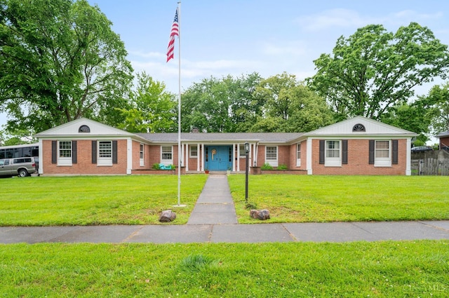 200 Santa Fe Rd, Middletown, OH 45042 - view of front of house featuring brick siding, a front lawn, and covered porch