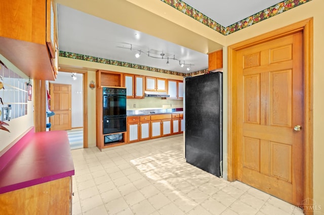 200 Santa Fe Rd, Middletown, OH 45042 - kitchen featuring black appliances, under cabinet range hood, and light floors