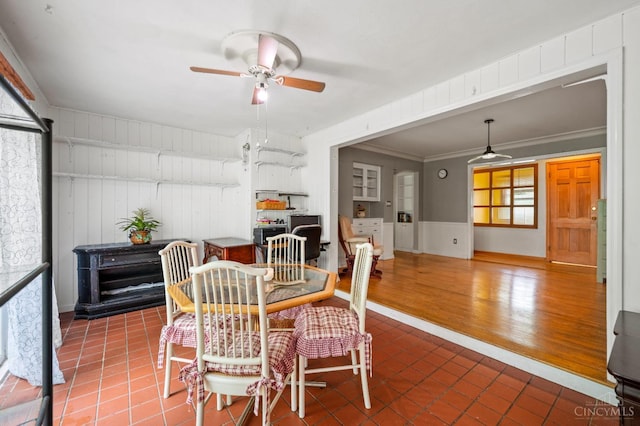 200 Santa Fe Rd, Middletown, OH 45042 - dining space featuring a ceiling fan, tile patterned flooring, crown molding, and wainscoting