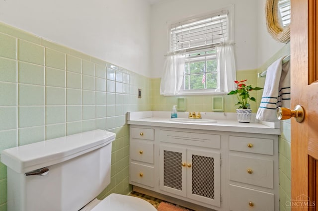 200 Santa Fe Rd, Middletown, OH 45042 - half bathroom with tile walls, vanity, and a wainscoted wall