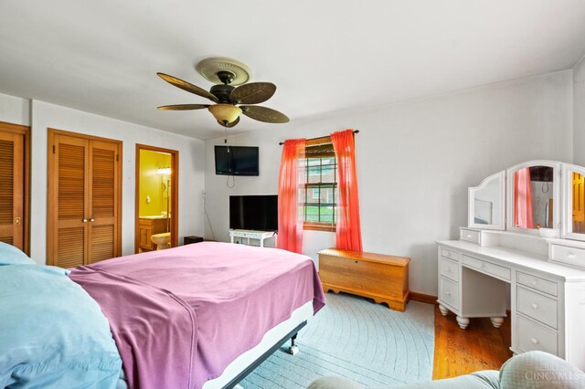 200 Santa Fe Rd, Middletown, OH 45042 - bedroom with light wood-type flooring, a ceiling fan, and connected bathroom