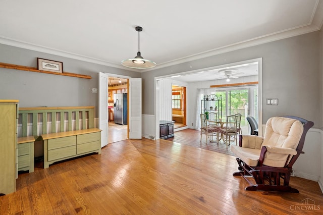 200 Santa Fe Rd, Middletown, OH 45042 - sitting room with ornamental molding, wood finished floors, ceiling fan, and a wainscoted wall