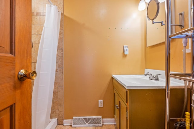 200 Santa Fe Rd, Middletown, OH 45042 - bathroom with vanity, a tile shower, and tile patterned flooring