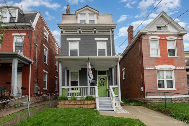 4226 Chambers St, Cincinnati, OH 45223 - victorian home with covered porch, mansard roof, and a chimney