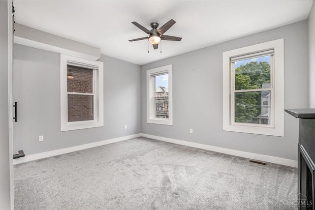 4226 Chambers St, Cincinnati, OH 45223 - unfurnished room featuring plenty of natural light, carpet floors, and a ceiling fan