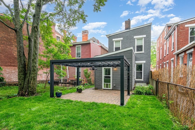 4226 Chambers St, Cincinnati, OH 45223 - back of property with a gazebo, a chimney, brick siding, and a patio