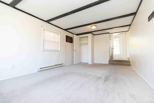 6785 Marvin Ave, North College Hill, OH 45224 - unfurnished bedroom featuring a baseboard radiator, beamed ceiling, carpet flooring, a wall mounted AC, and a closet